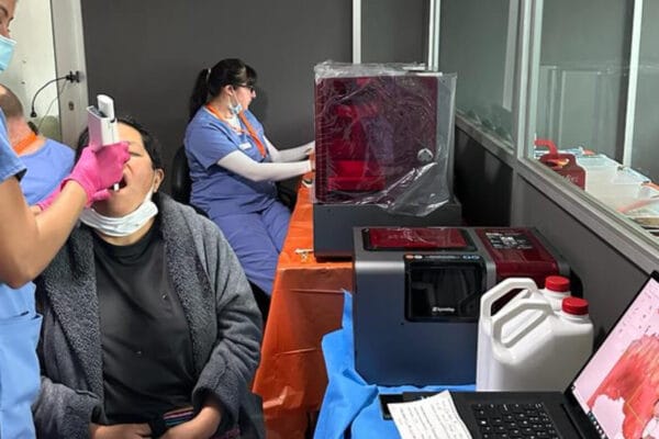 IMR dental volunteer maps a patient's teeth for a 3D printed dental bridge